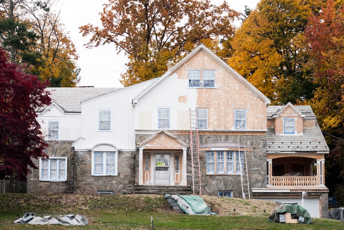 Exterior of a house undergoing painting and renovation